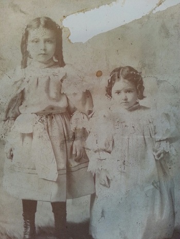 Gramma, the older girl, with one of her siblings (adoptive family)