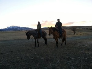 My daughter and son in law riding Bo and Denny in the dusk.