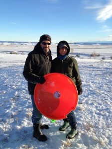 Sledding on a crisp clear cold day.