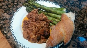 Pulled pork with grilled asparagus, French bread. Pickled cabbage not pictured.